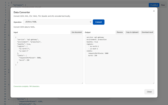 Data Converter performing a JSON-to-YAML conversion with operation controls, input, output, copy, reverse, and download actions